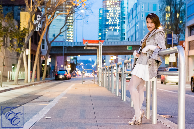 Light grey cape, peplum top, white flared skirt, grey hosiery, arm warmers, and metallic pumps and clutch: entire outfit