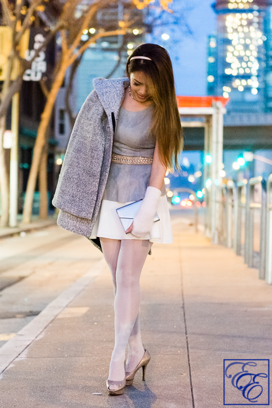 Light grey cape, peplum top, white flared skirt, grey hosiery, arm warmers, and metallic pumps and clutch: entire outfit