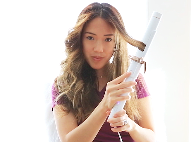 How to curl hair with T3 Twirl360 curling iron - pressing button to activate rotating mechanism