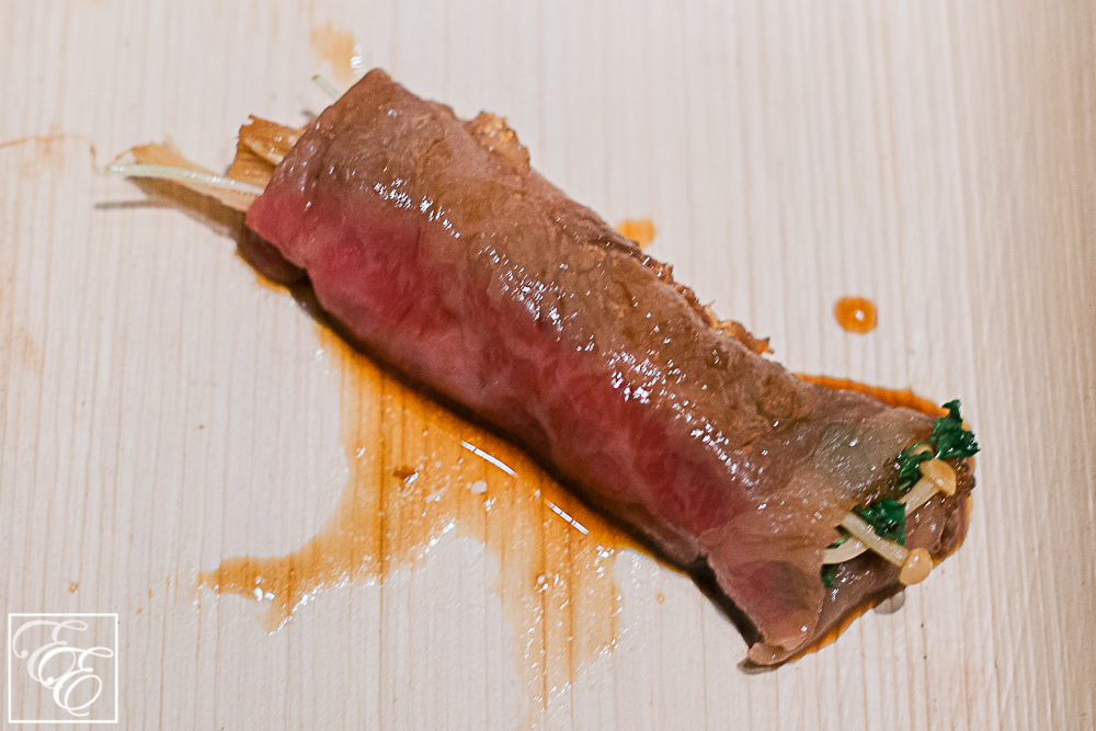 Beef sukiyaki with enoki mushrooms, greens, and  tamari soy sauce