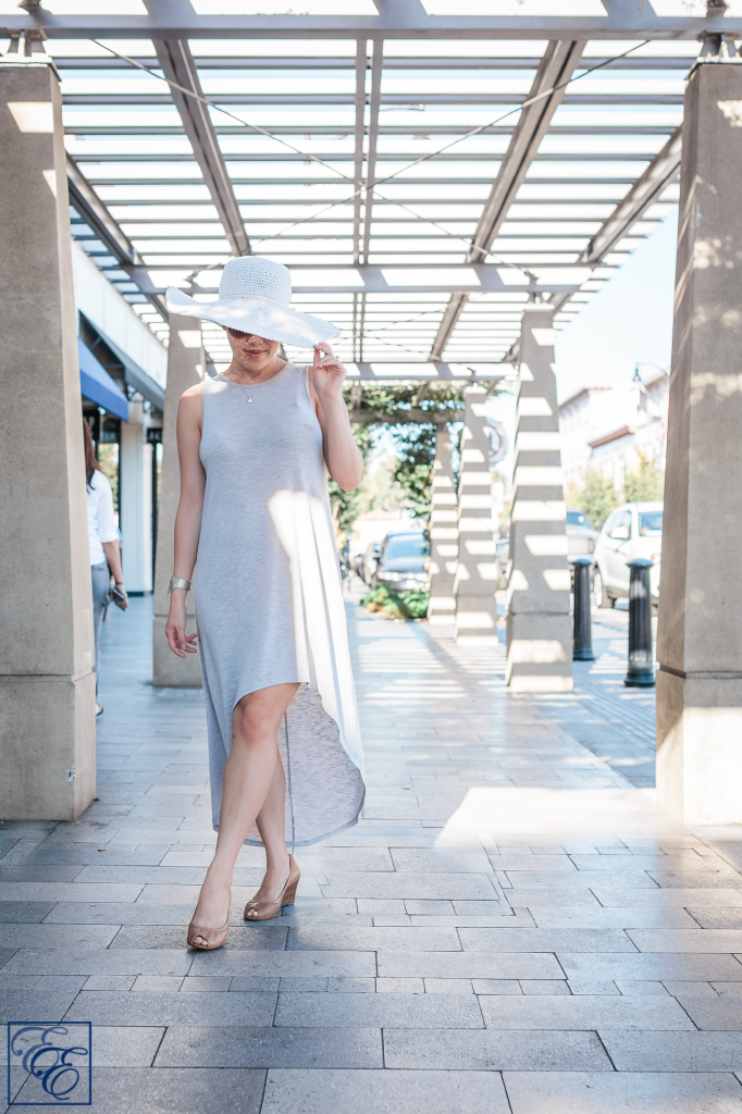 Post-pregnancy new mom style: loosely-flowing dress, wide-brimmed sunhat and sunglasses