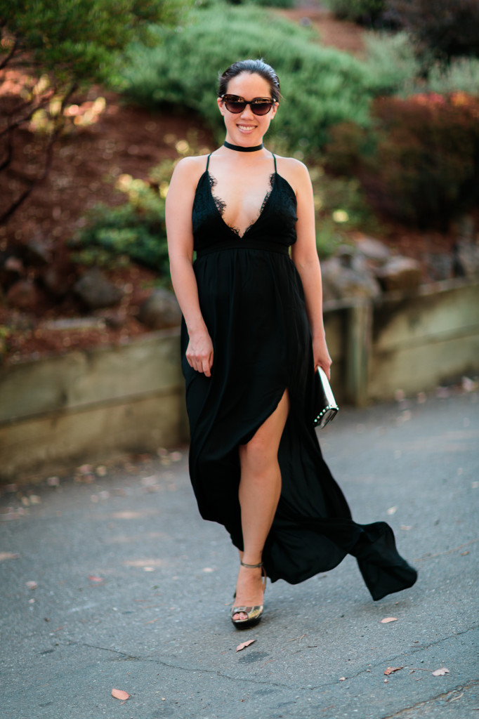 Black maxi dress with side slit and lace plunge v-neck by Tobi. Chanel sunglasses, Cole Haan gold heels, Valentino rockstud bracelet clutch