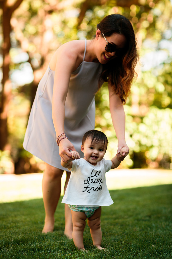 mama wearing Tobi shift dress, Bebe sunhat, Chanel glasses, baby girl wearing Joe Fresh top