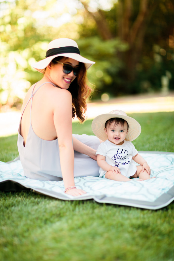 mama wearing Tobi shift dress, Bebe sunhat, Chanel glasses, baby girl wearing Joe Fresh top